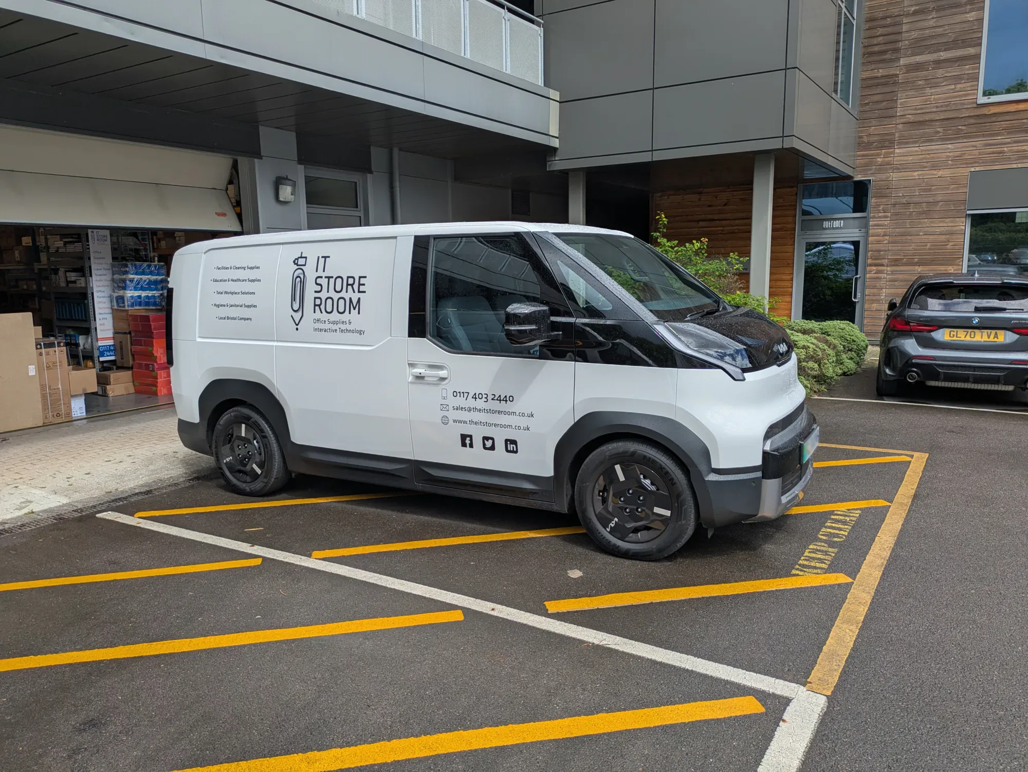 IT Store Room's electric Kia business van outside its Bristol premises